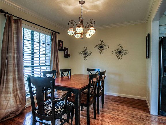 Beautiful flooring and lights bring you cheer in this Dining Room with plenty of space to eat with guests or family.