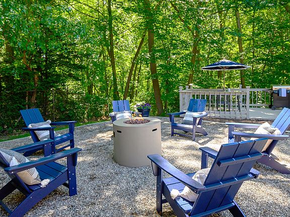 Gather Around Our Firepit Amidst a Serene Nature View!