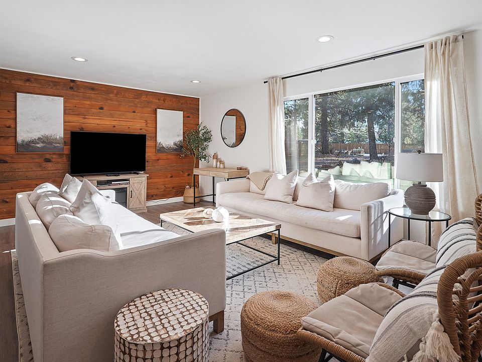 light and bright living room, with smart TV and fireplace