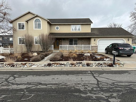 Front view of house including xeriscaped yard