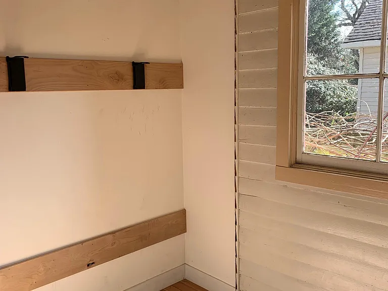 Back entrance mudroom with bike storage-- shelves for storage to the left (out of the picture)
