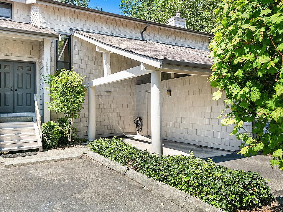 Front door, carport with locked storage for skis, golf clubs, bikes, etc