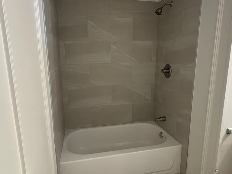 Bathroom, tub and toliet.