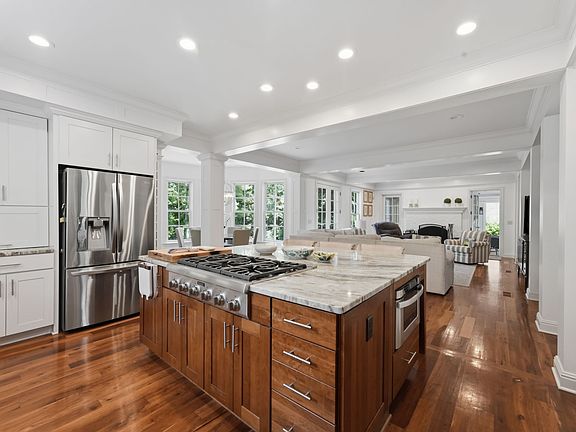 Thermador appliances, double overs, gas cooktop, and dishwasher.