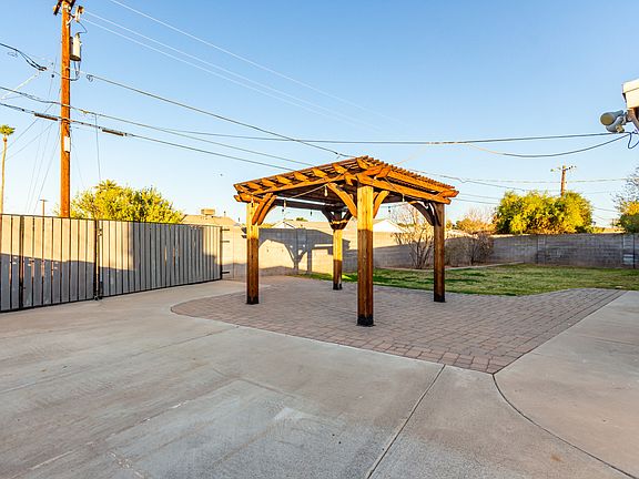 RV gate and pergola, landscaping covered by landlord.