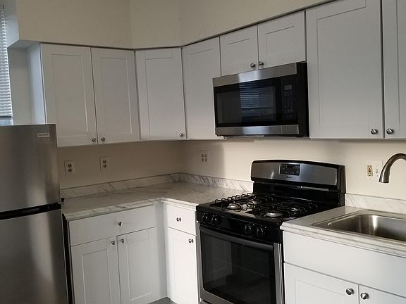 Remodeled kitchen including stainless steel appliances