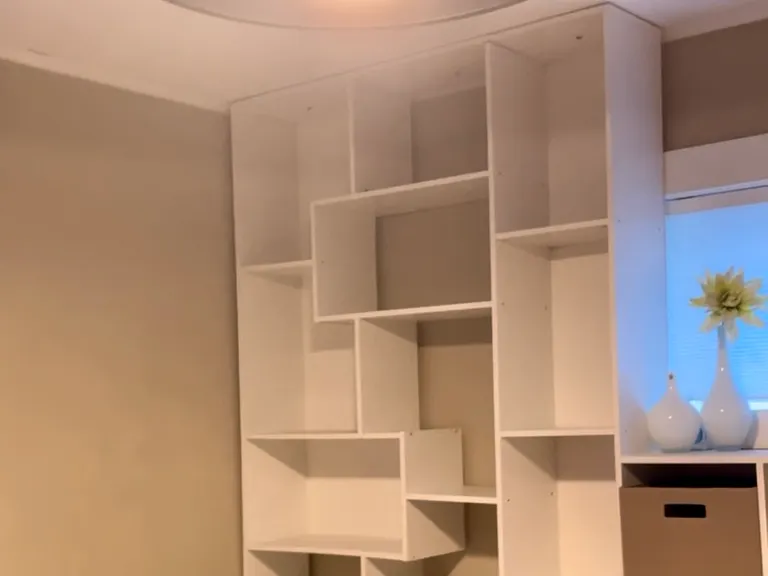 Small bedroom - built in unit with L shaped desk, ceiling fan.