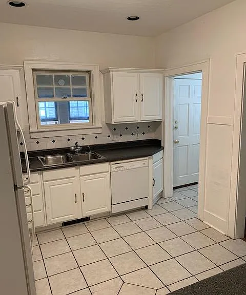 Kitchen with pantry rear entrance