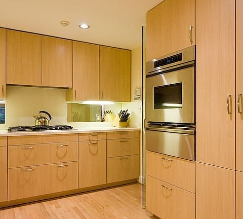 THE KITCHEN HAS A GAS COOKTOP, SUBZERO REFRIGERATOR, AND BOSCH DISHWASHER 