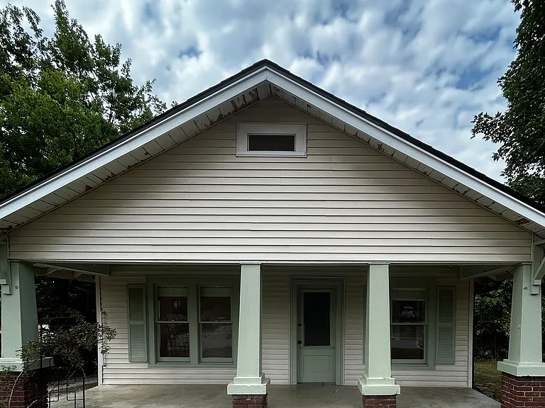 Inviting covered front porch on a quiet street