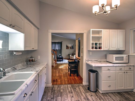 Here is another view of the kitchen. Walk through to the living room.