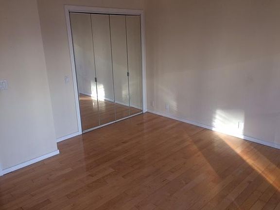 Bedroom 2, with hardwood flooring