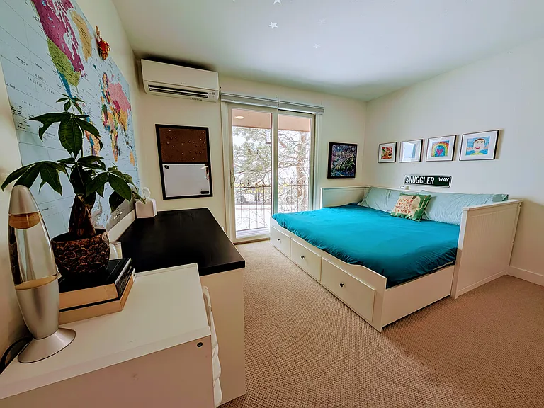 Upstairs Bedroom 2 - King bed that can be converted into a single daybed, desk, book shelves, a large walk-in closet, and access to a private balcony with open space views.