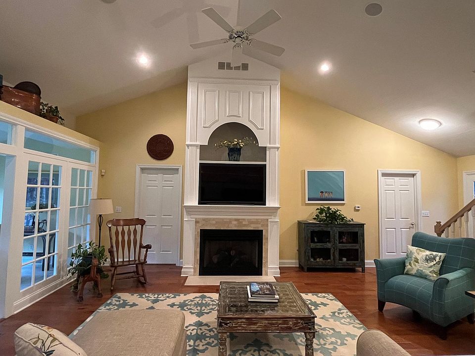 Airy living room with gas fireplace.