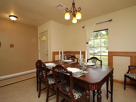 View of fireplace and formal dining from the entry.