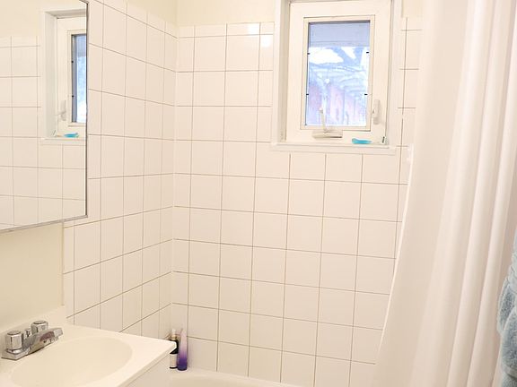 bathroom with full tub