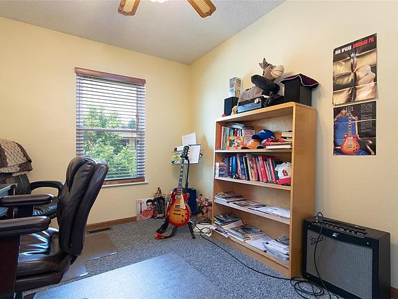 Space for your dining area, and look at all that gorgeous natural light! Sliding glass door opens directly onto the deck.