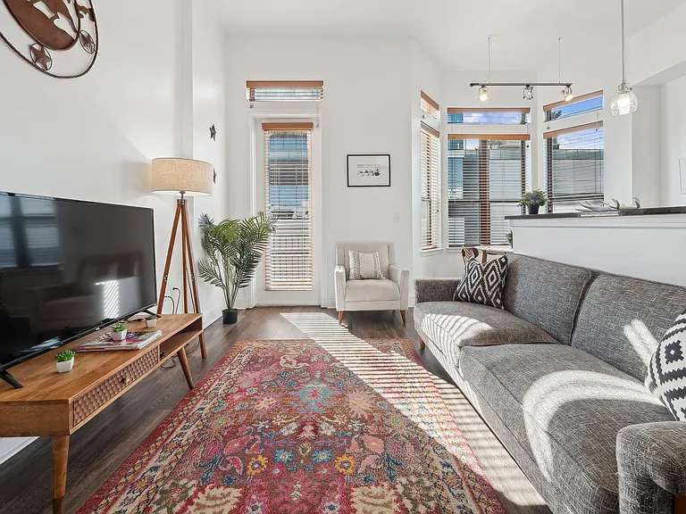 Experience the warmth and style of this sunlit living room, perfect for relaxation and entertaining. Experience the warmth and style of this sunlit living room, perfect for relaxation and entertaining.