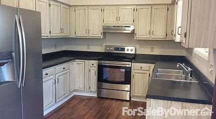 Just remodeled!
						:
						New SS range and hood, custom cabinets, new laminate floor