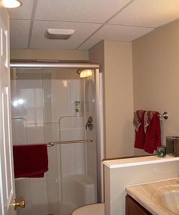 Full Guest Bathroom with linen closet