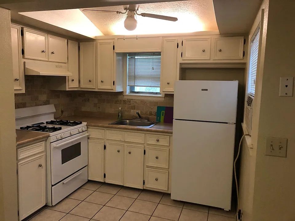 This is the kitchen. An extra microwave is currently in the corner of the counter if needed.