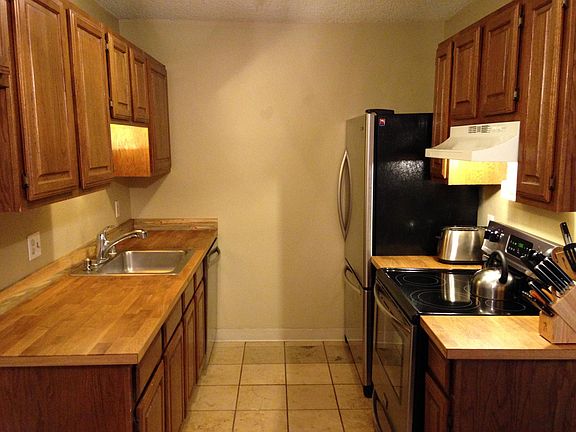 Kitchen with butcher block countertops, new floors and updat