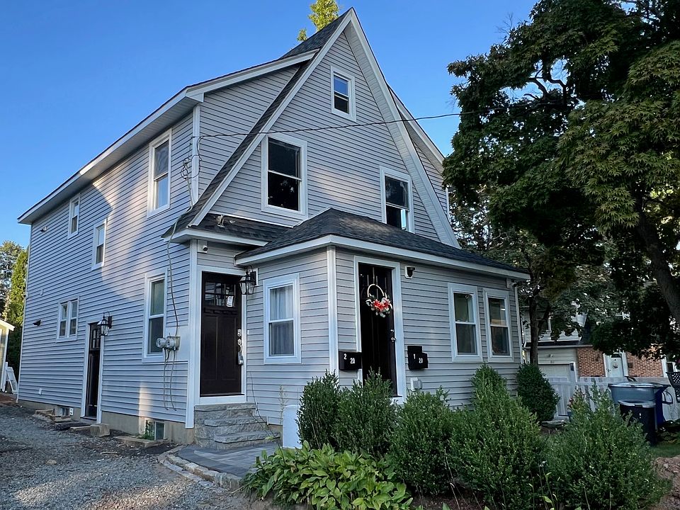 Front of Van Dyke Pl. Private entrance to first floor unit via door with door with wreath