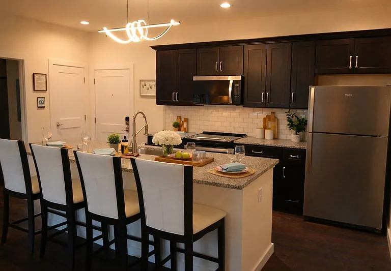 Kitchen With Island, Granite Countertops, and Stainless Steel Appliances