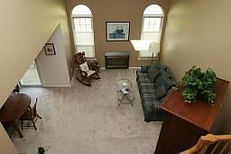 Two story family room with woodburning fireplace