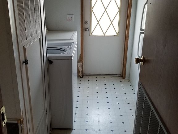 W & D & small fridge in laundry