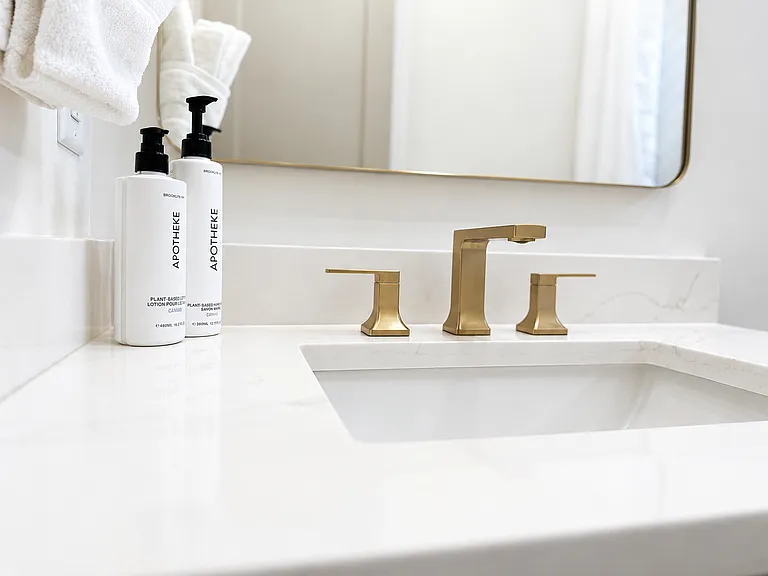 Super-clean, walk-in shower bathroom located off the Kirkwood Suite, with luxury bath amenities, plush towels, blow dryer and other essentials with clean spa-style finishes.