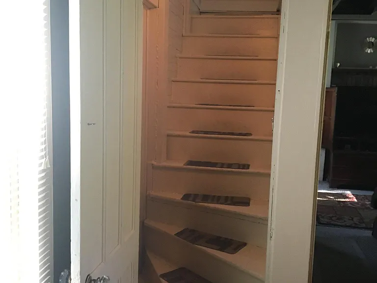 servents stairs up to bedroom and full bathroom