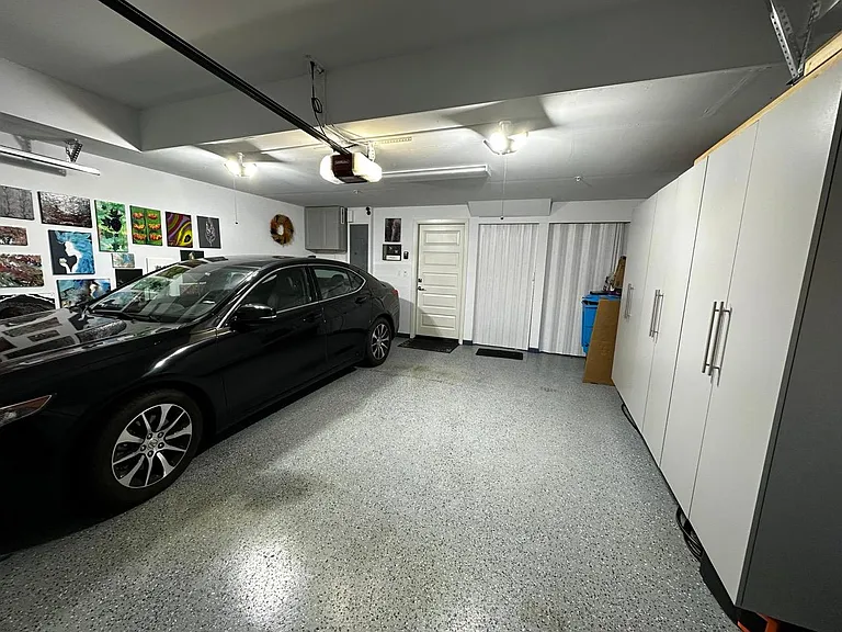 Finished Garage with Extra Overhead Lights and Tons of Storage Space