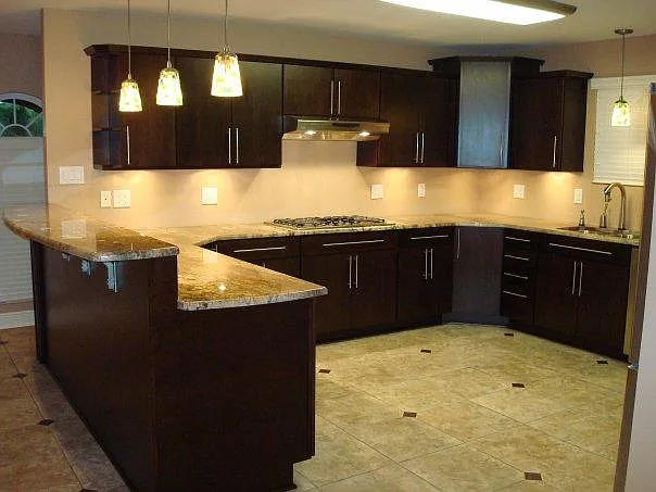 Large kitchen with stainless steel appliances.