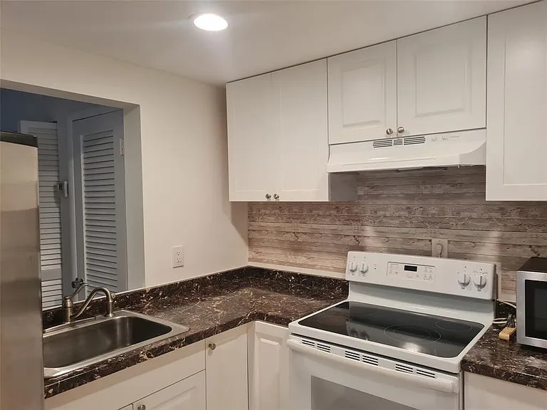 300 Golden Isles Dr #104 — Photo 13