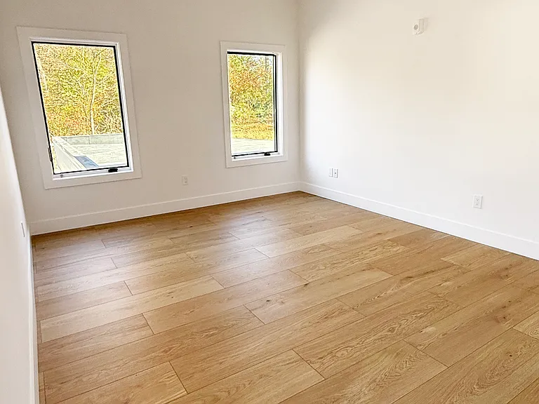 Primary bedroom with ensuite bathroom and built-in double closet
