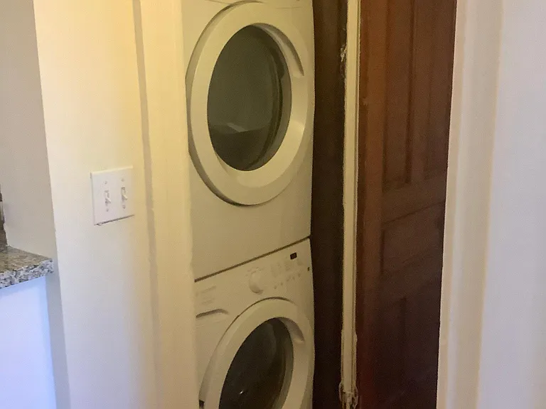 Full-size washer and dryer located in the apartment.