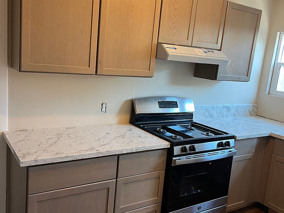 Kitchen with new gas stove, granite and cabinets