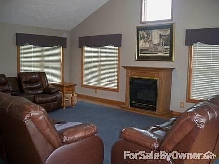 Living Room
						:
						approximately 26 x 26 with double sliding doors out to the stamped cement porch