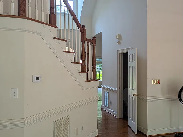 Staircase towards front door.