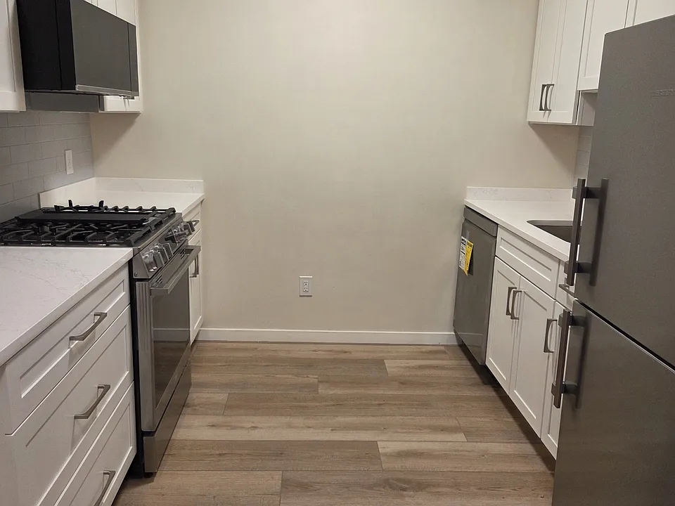Large galley kitchen with all new stainless steel appliances- Liebherr, LG