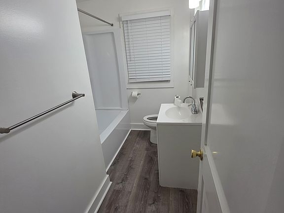 bathroom with bathtub and shower