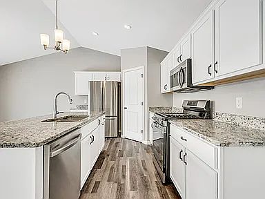 Beautiful Kitchen With Granite Counter Tops.