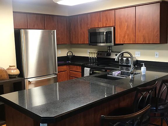 Granite counter tops, stainless appliances, wood floor