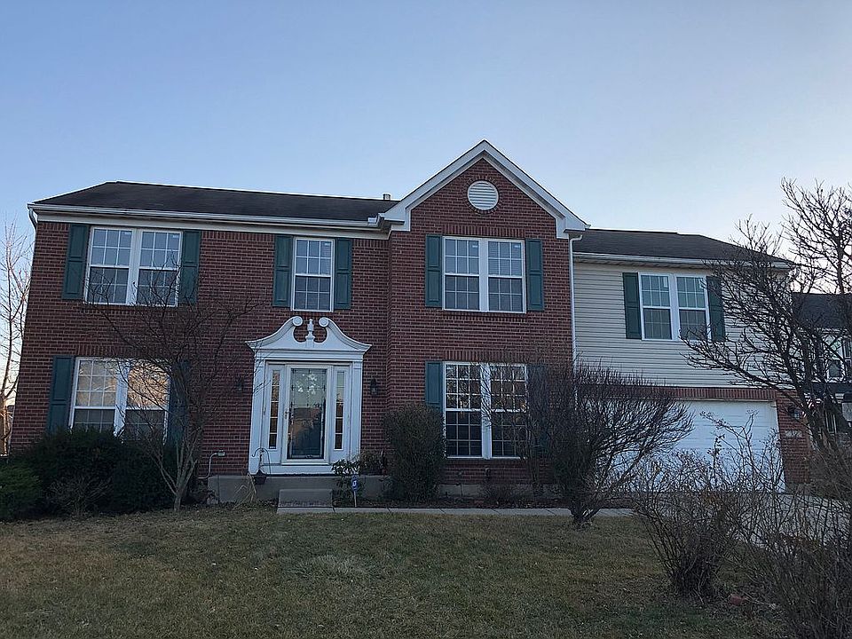 Front view w/ 2-car garage.