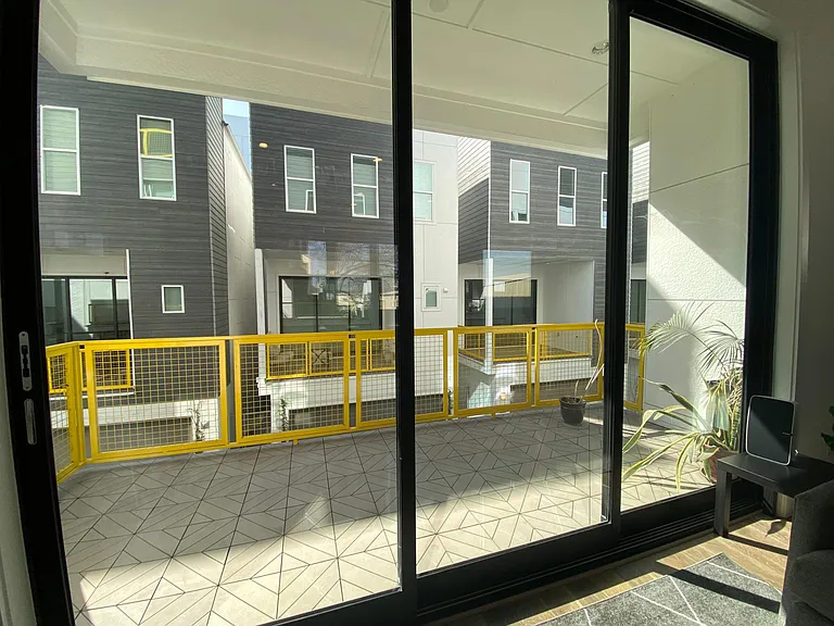 2nd floor patio with gas and water hookups outside. Perfect for your gas grill!
