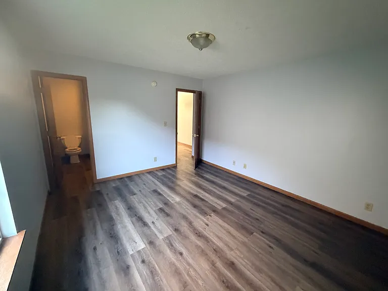 2nd bedroom facing towards the entrance of the 2nd bathroom and 2nd bedroom main entrance