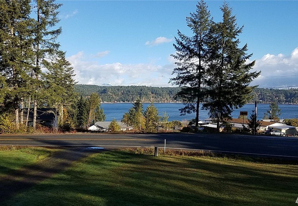 View from front door.  This view screams for a large deck to watch sunsets over the water and mtns year 'round.