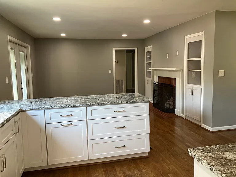 Kitchen looking into Den showing door to the Two Bedrooms and also the Patio Door to porch and back yard.