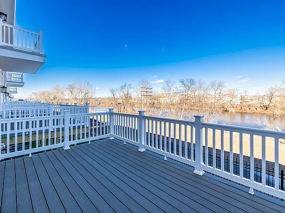 Deck attached to kitchen with Waterview's